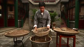 Zhang Yu Filters Completely Dried Clay Through a Sieve with 2 Millimeter Holes
