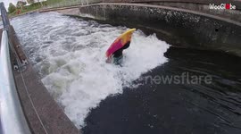 UK kayaker demonstrates freestyling ability by front flipping in rapids