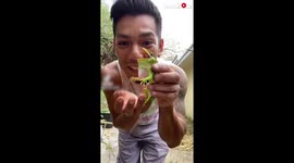 'Man Gets his Finger Bitten While Playing with a Lizard'