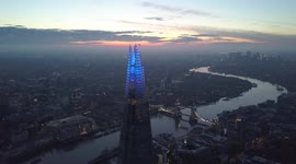 Colourful sky above The Shard during sunrise - 4k aerial footage