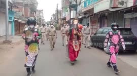 Men dress up as different characters to spread awareness regarding COVID-19 in central India