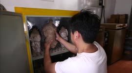 Zhang Yu Use Electric Furnace to Fire the Clay Figures to Make Them Watertight and Durable