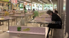 Diners eat with protective screens amid Covid-19 resurgence in Thailand
