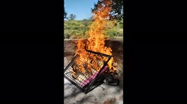 Start of an artisan barbecue filmed in slow motion, spectacular flames