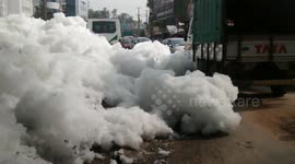 Thick foam spills onto street in Bangalore, India