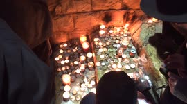 Lighting Candles in Memory of Rashbi