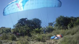 Paraglider crashes into sunbathers on beach ( No Edits)