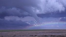 Rainbow appears next to tornado in Colorado, US