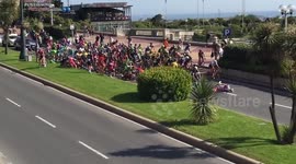 Spectator causes huge crash after trying to join bike race