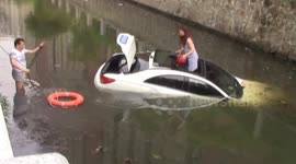 Woman saved from sinking car