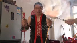 Man conducts electricity to cook sausages