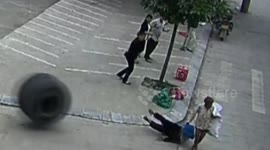 Loose tyre knocks elderly woman to the ground in China