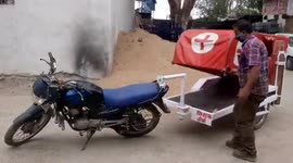 Engineer builds a motorbike makeshift ambulance to help COVID-19 patients in India