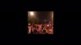 Colombians run around bonfire and chant 'Resistance