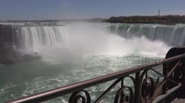 Huge crowds of people on the maid of the mist boat on the US side of Niagara falls while in Ontario Canada people are not allowed to leave their homes unless for groceries or work permitted by the Doug Ford government which is very little.