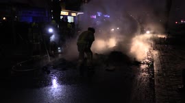 Firemen Extinguish Dustinbin Fire During First of May Riot in Berlin