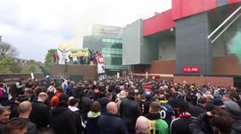 Angry Manchester United fans stage a protest against the club's owners at their Old Trafford stadium