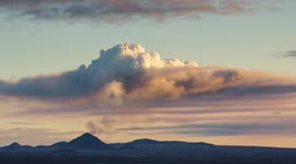 Time lapse of Geldingadals Volcano in Iceland influencing clouds above. Volcanic eruption spewing gas high into the atmosphere change the weather.
