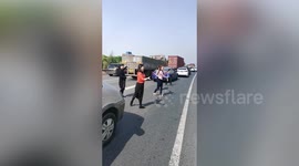 Motorists begin dancing to pass time as traffic jam builds on expressway in China