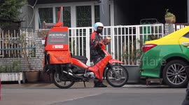 Motorcycle delivery service during pandemic in Thailand, this is the new lifestyle, made necessary because of the virus.