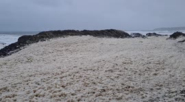 Stormy Conditions Whip Up Sea Foam in Cork Ireland with Yellow Weather Warning in Place