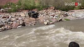 'Crossing a Mountain River in a Jeep'