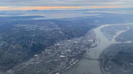 Timelapse flying into Vancouver YVR sunset, mountains and cityscape Canada