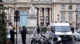 Extinction Rebellion activists chain themselves at fences of the Assemblee Nationale in Paris