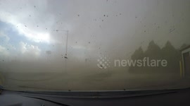Terrifying moment vehicle of storm chaser gets violently rocked by passing landspout in Colorado