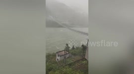 Terrifying scene as cable bridge violently swings as strong winds batter southern China