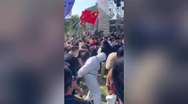 When the vibe is too infectious! Man spotted wearing PPE while rocking out at music festival in China