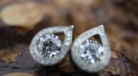 Intricate process as jeweller crafts earrings using recycled diamonds and gold