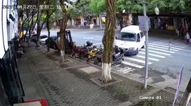 Nail-biting moment vehicle grinds to halt just inches away from toddler crossing road in China