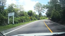 Driver dodges overloaded pickup truck driving straight at them