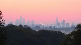 Real time sunrise over London city skyline, moving over The Shard