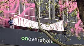 Climate activists deface HS2 London headquarters with bright pink paint