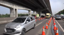 Police check and stop people leaving the Capital to celebrate Eid Al Fitr, Indonesia