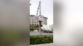 Driver injured after strong wind sees billboard crash onto vehicle in China