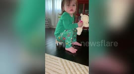 Adorable tot insists on sitting on a tiny doll’s chair to watch TV