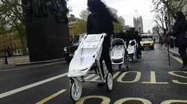 Extinction Rebellion protesters stage London demonstration dressed in funeral attire.