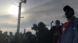 Arsenal fans chanting outside Emirates stadium as part of a Kroenke Out protest in London