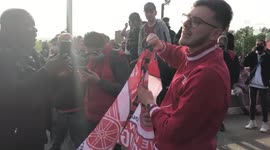 Arsenal fans singing a bizarre rendition of Addams family theme tune outside Emirates stadium as part of a Kroenke Out protest in London