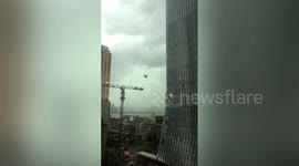 Suspended platform crashes into skyscraper leaving 2 window cleaners dead in China