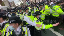 Pro-Palestinian supporters chant 'Allahu Akbar' at police during tense Whitehall protest
