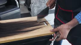 Lahore barber uses fire and butcher’s knives to style hair, Pakistan