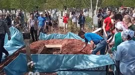 Dozens attend funeral of 26-year-old teacher gunned down in Russia school shooting