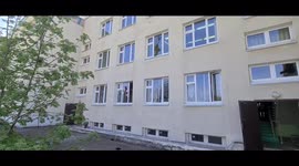 Broken windows in the school where the shooting took place. 9 people died