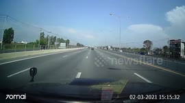 Loose wheel flies into car windscreen on road in Thailand