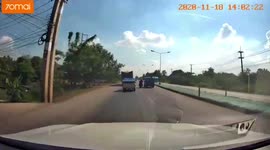 Water gallon containers fly off the back of a moving pickup truck