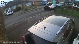 Man super bike fall on him as he tries to leave  his house